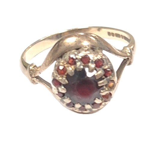 9CT Gold and Large Ruby Ring, surrounded by twelve smaller rubies