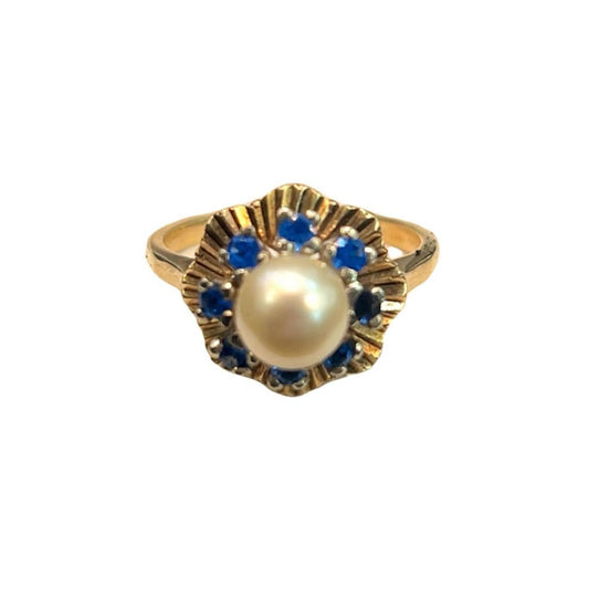 9 CT Gold Ring. One pearlescent & 8 turquoise coloured stones. - Size N