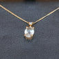 18CT GOLD PENDANT WITH PINK-HUE AND WHITE STONES WITH CHAIN