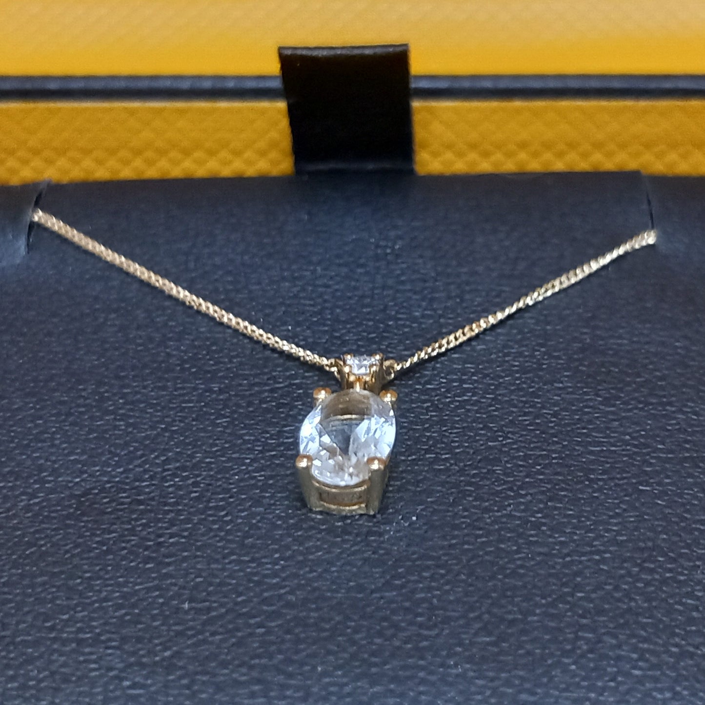 18CT GOLD PENDANT WITH PINK-HUE AND WHITE STONES WITH CHAIN