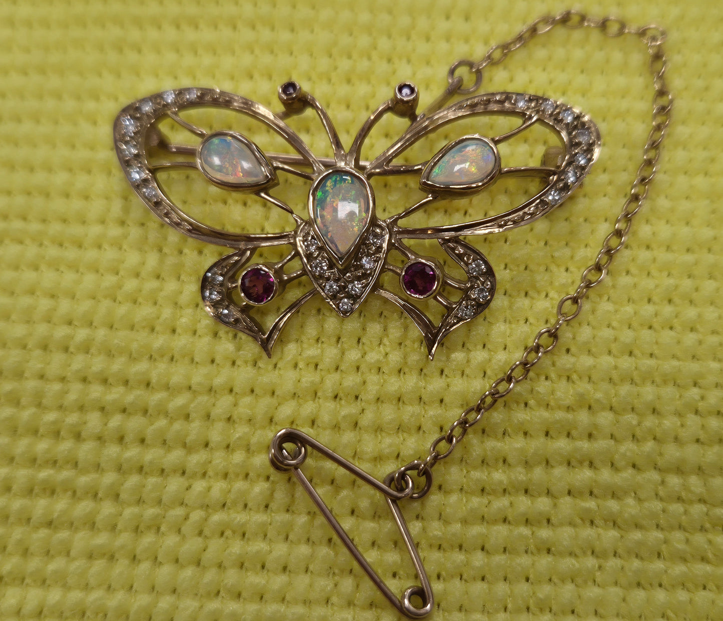 9CT GOLD BUTTERFLY BROOCH, OPALS AND RED STONES