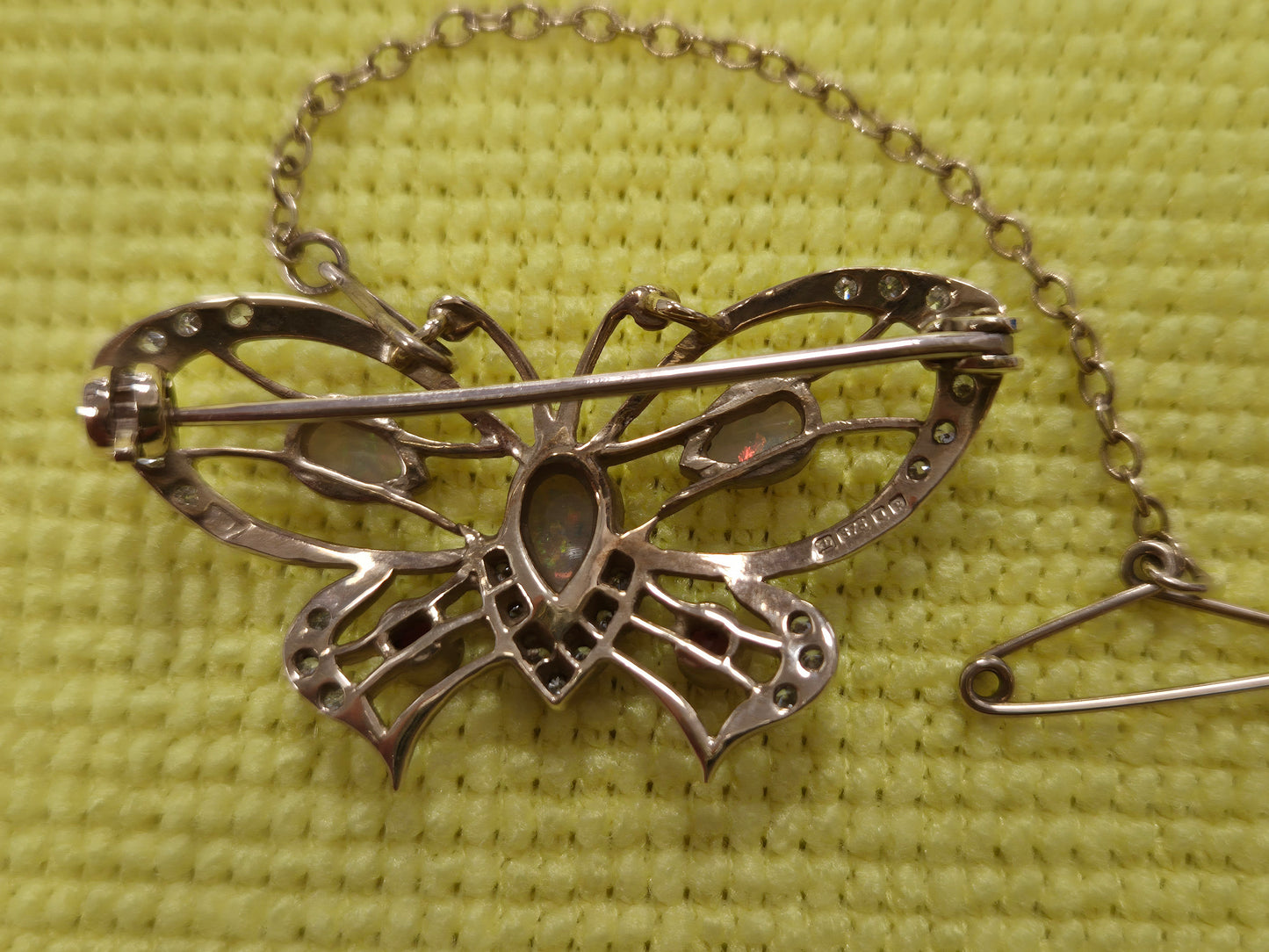 9CT GOLD BUTTERFLY BROOCH, OPALS AND RED STONES